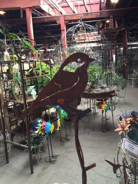 Black Capped Chickadee sitting on Stake